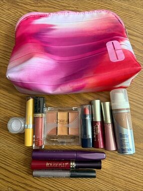 Clinique Pink and Red Gradient Makeup Bag with Assorted Daily Essentials
